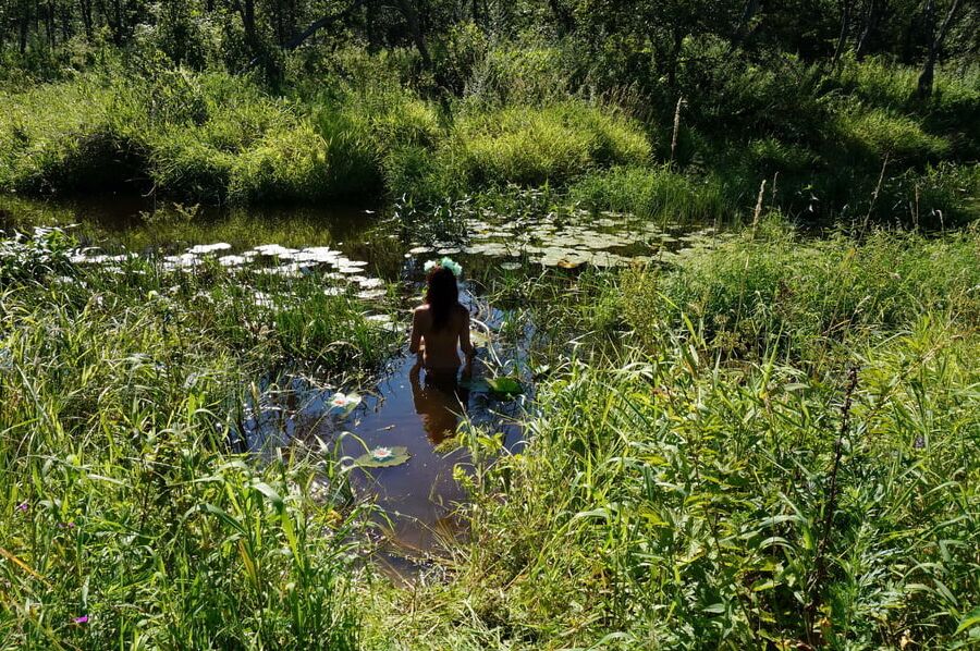 In a weedy pond