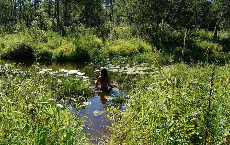 In a weedy pond