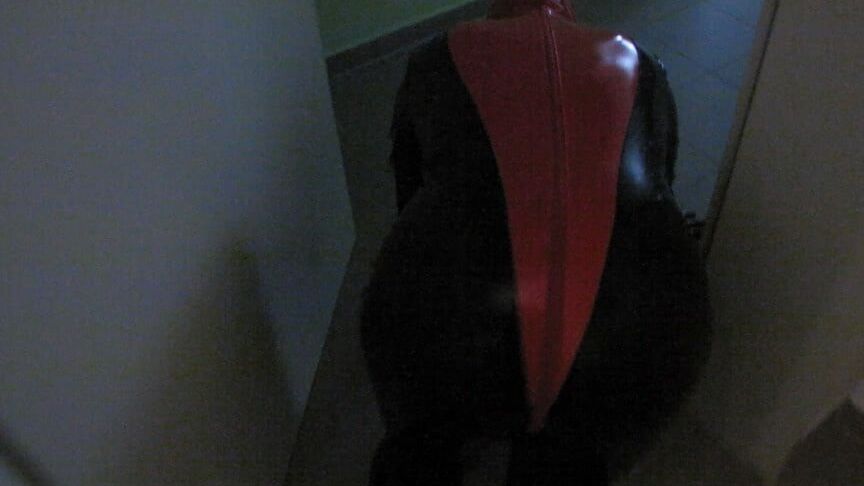 Petplay in latex suit ...