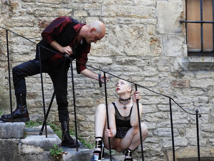 Bdsm couple walking in town