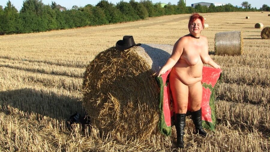 Anna naked on straw bales ...