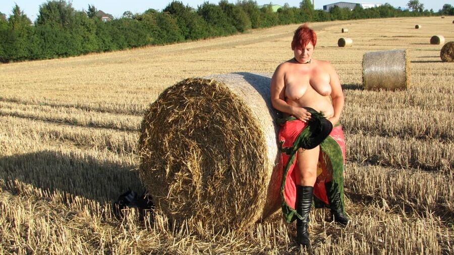 Anna naked on straw bales ...