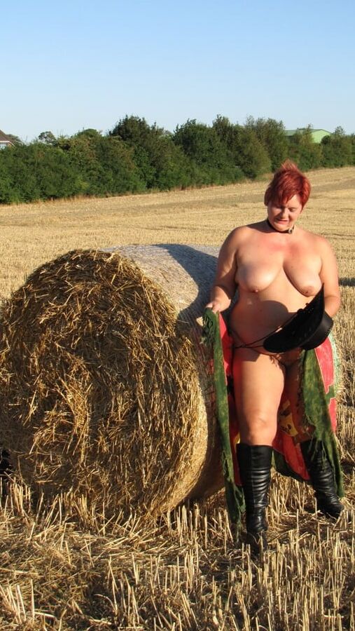 Anna naked on straw bales ...