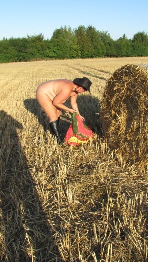 Anna naked on straw bales ...