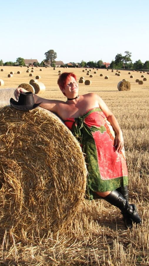 Anna naked on straw bales ...