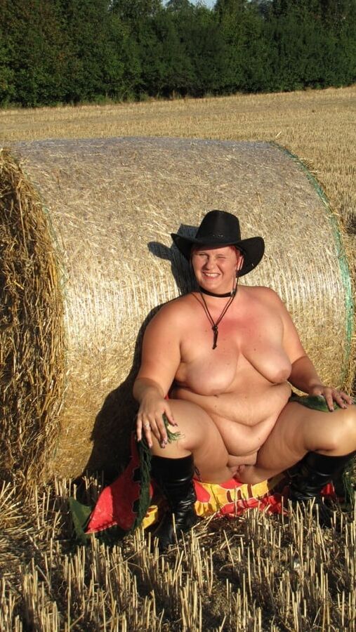 Anna naked on straw bales ...