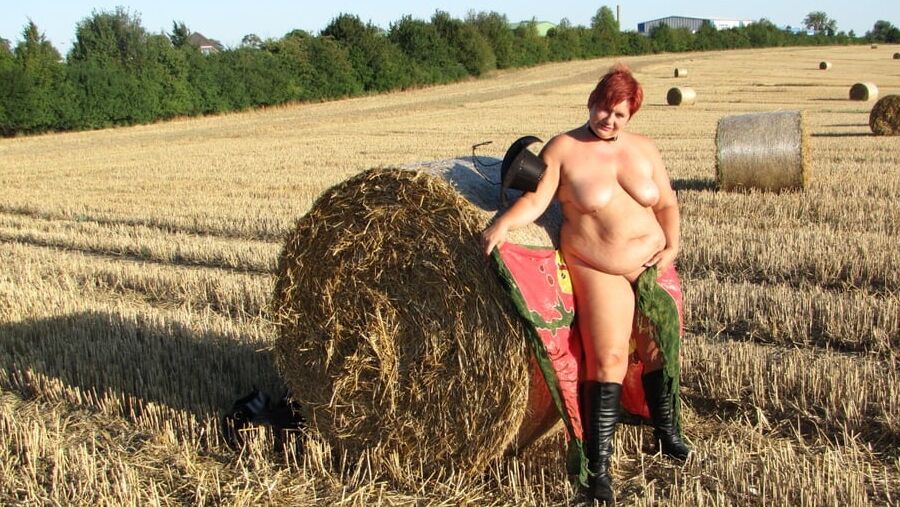 Anna naked on straw bales ...