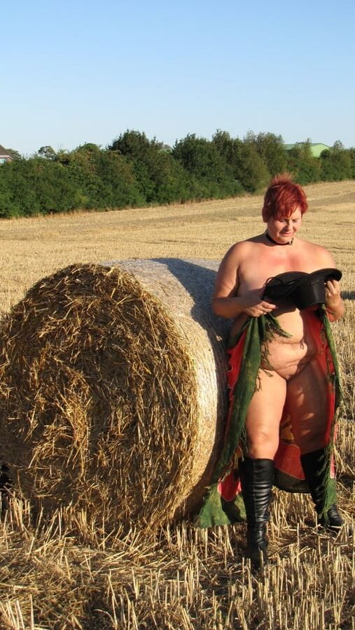 Anna naked on straw bales ...