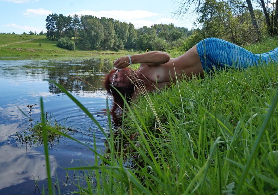 Mermaid plays with water