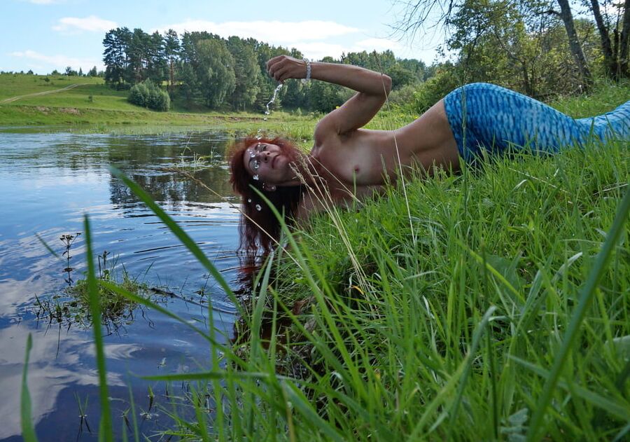 Mermaid plays with water