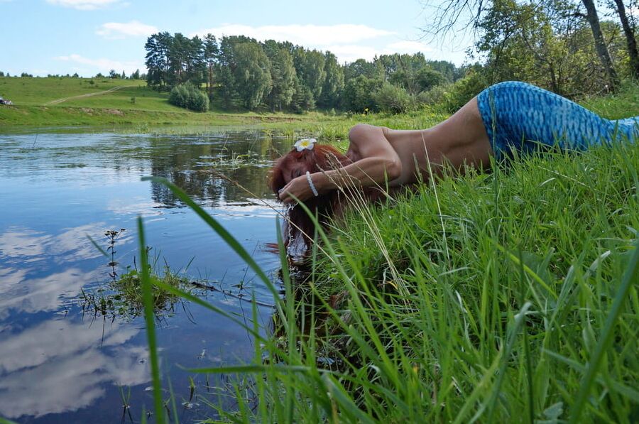 Mermaid plays with water