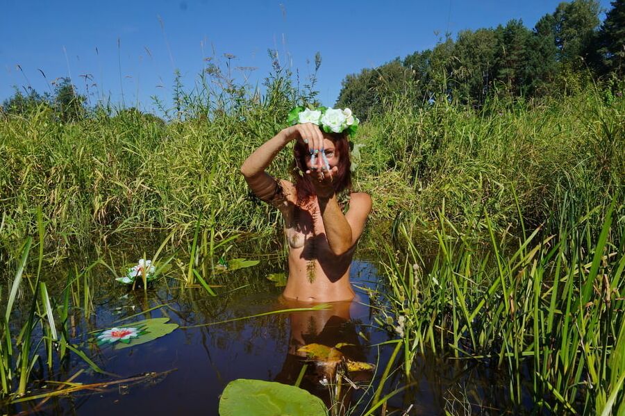 In pond with waterflowers