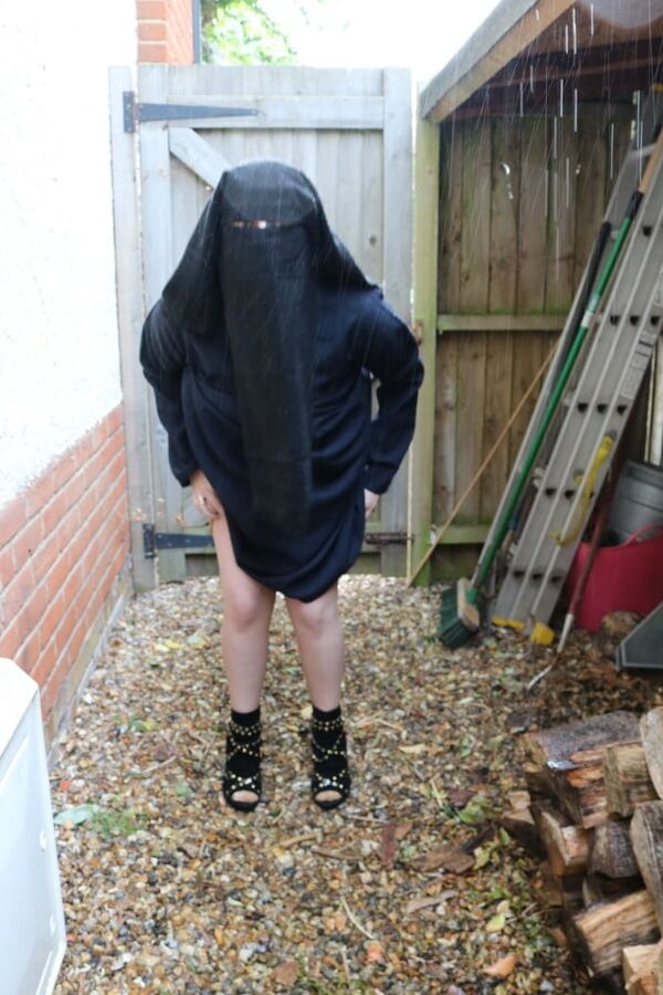 Burqa Outdoors Flashing in the Rain