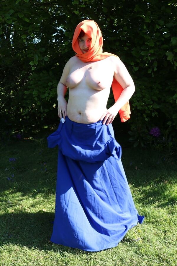 Hijab and abaya flashing outdoors