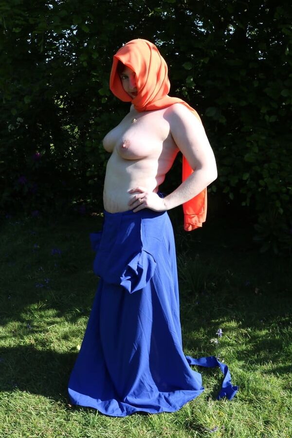 Hijab and abaya flashing outdoors