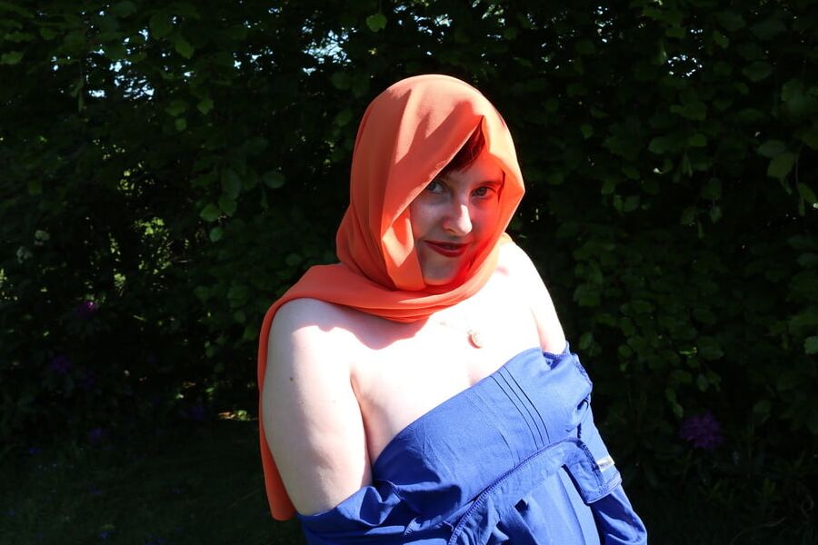Hijab and abaya flashing outdoors