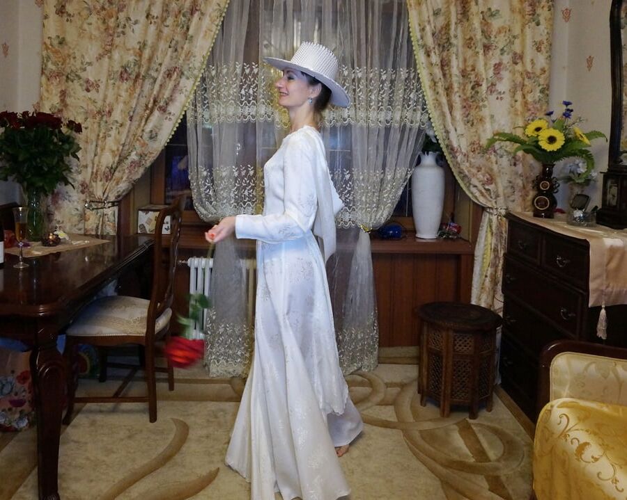 In Wedding Dress and White Hat