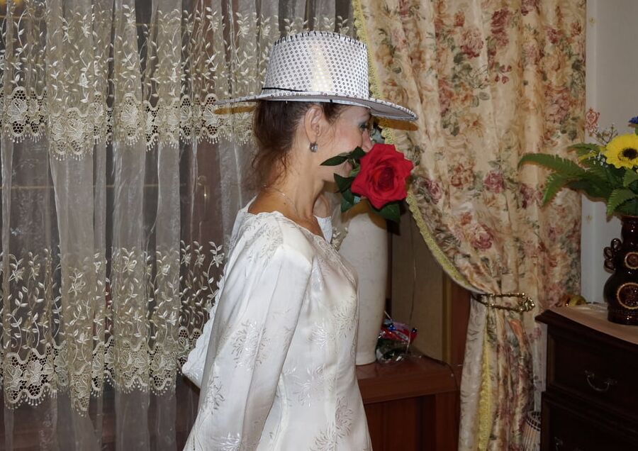 In Wedding Dress and White Hat