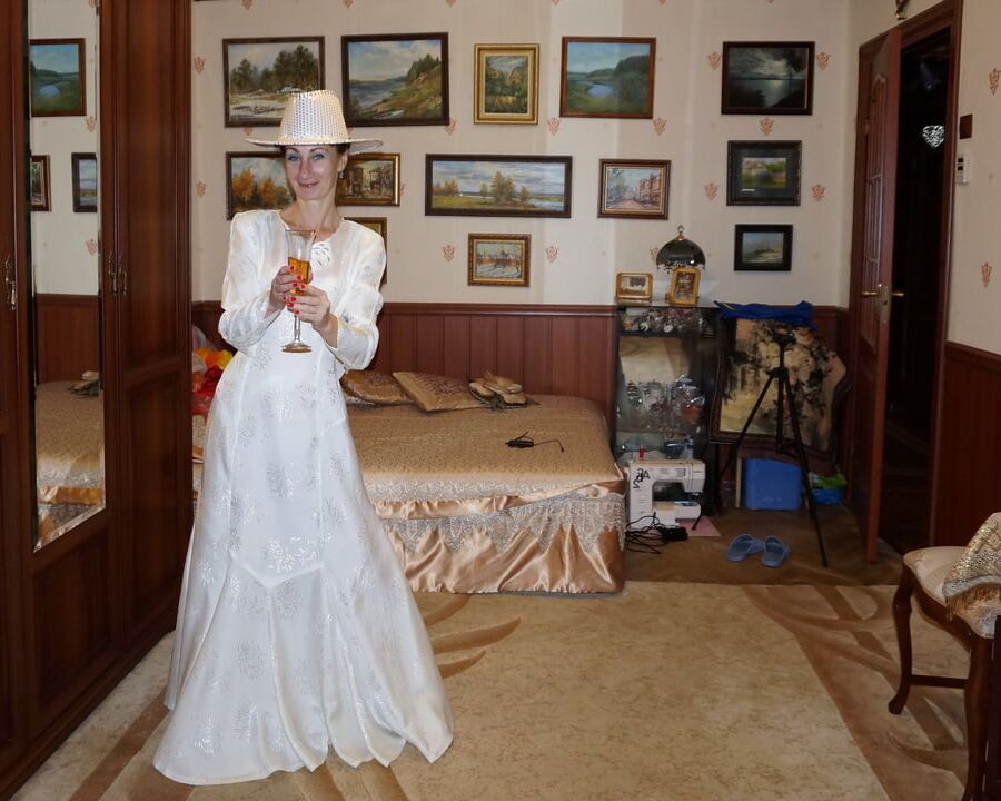 In Wedding Dress and White Hat