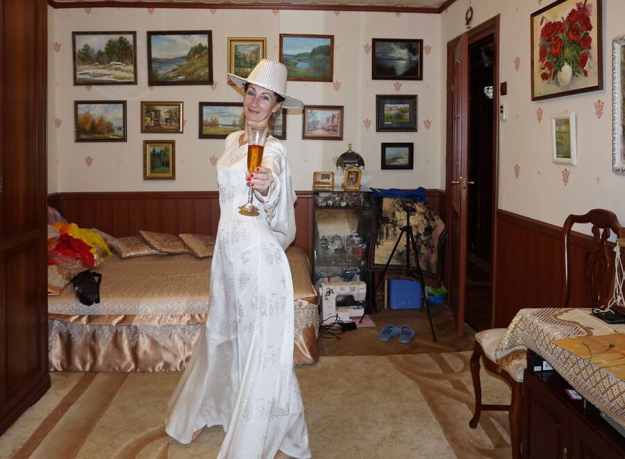In Wedding Dress and White Hat