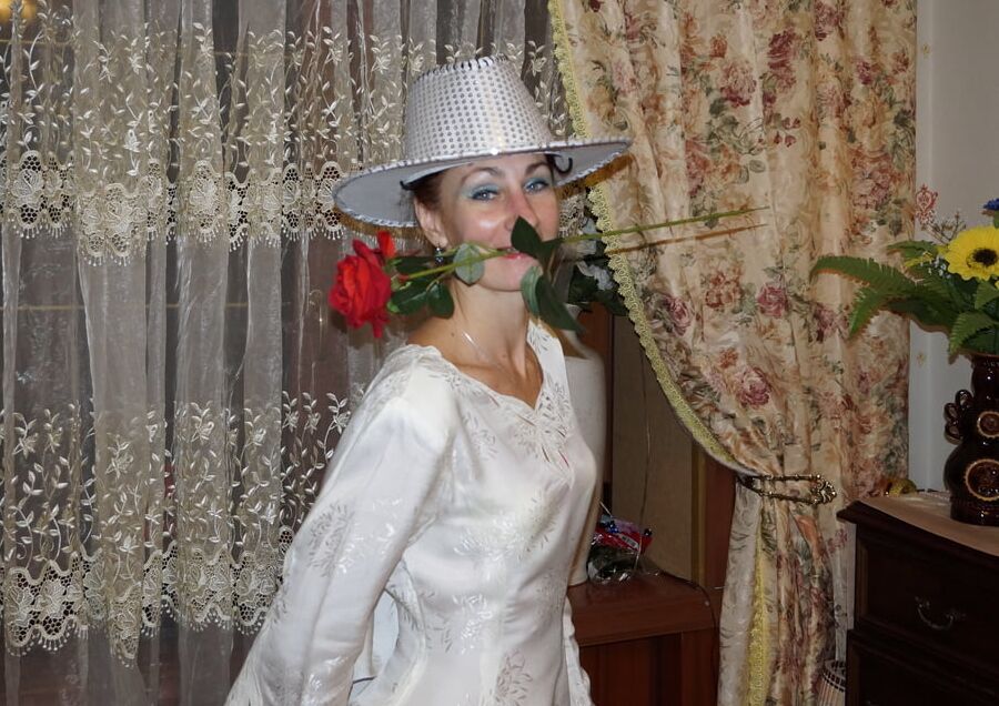 In Wedding Dress and White Hat