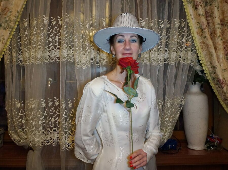 In Wedding Dress and White Hat