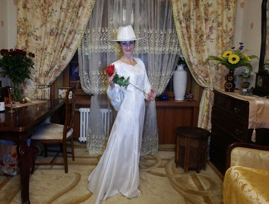 In Wedding Dress and White Hat