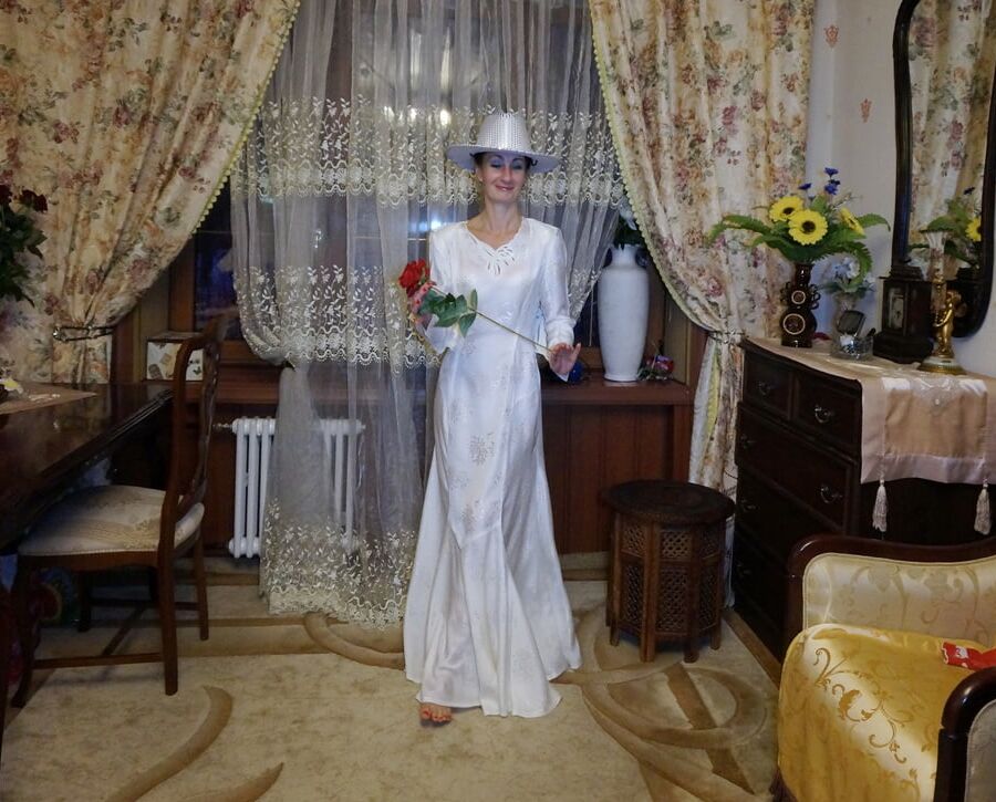 In Wedding Dress and White Hat