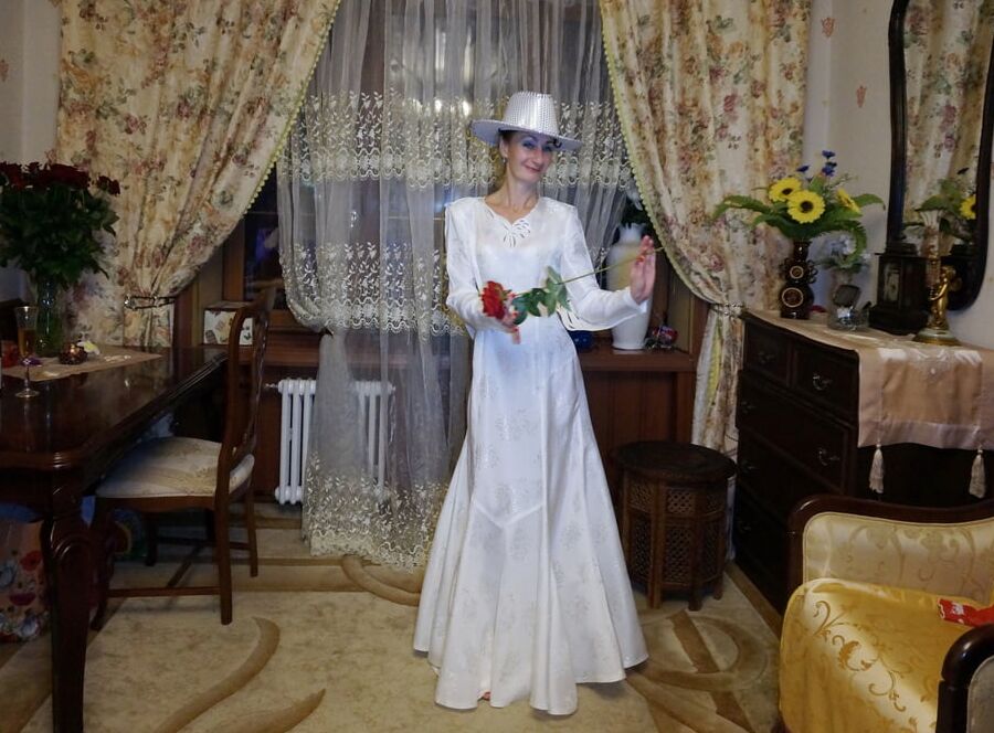 In Wedding Dress and White Hat