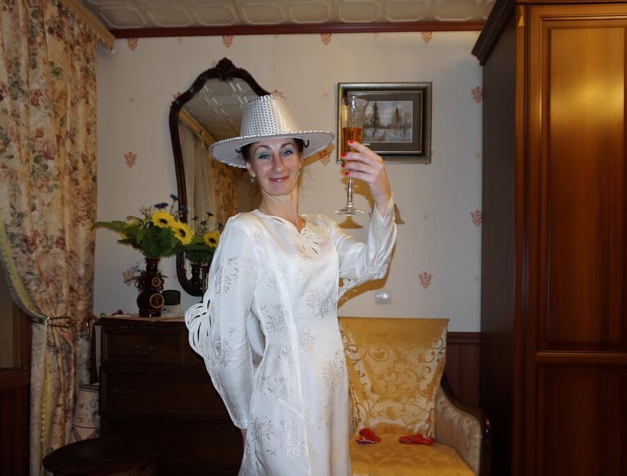 In Wedding Dress and White Hat