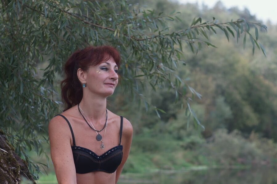 Black bikini near tree upon river
