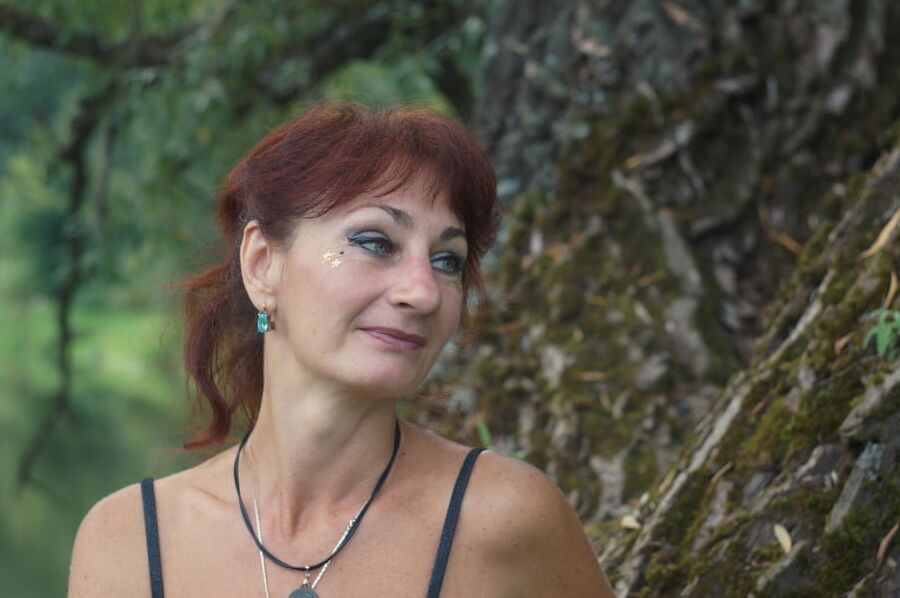 Black bikini near tree upon river