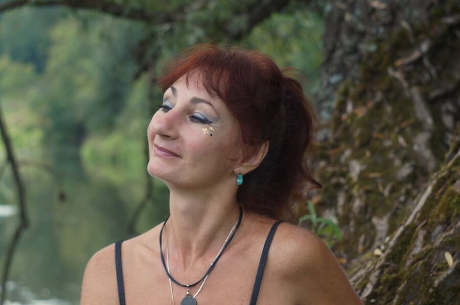 Black bikini near tree upon river