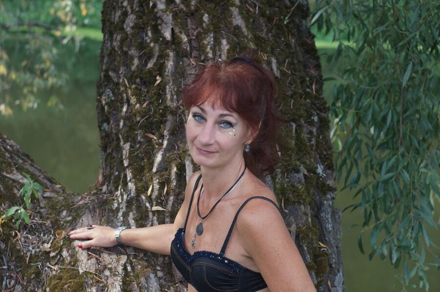 Black bikini near tree upon river