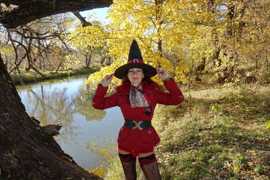 In Hat on Yellow Leaves Background