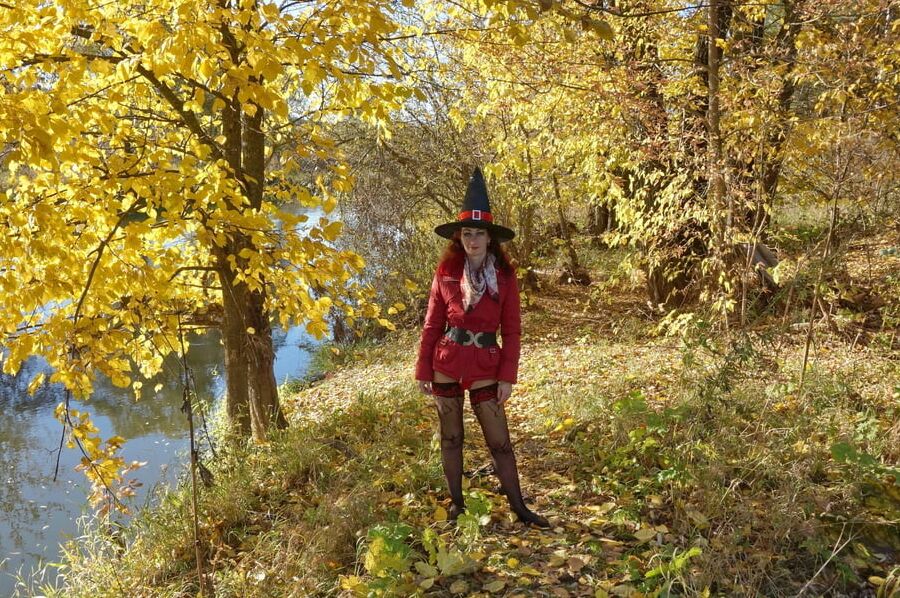 In Hat on Yellow Leaves Background