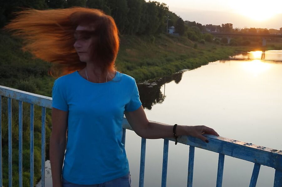 Flamehair in evening on the bridge