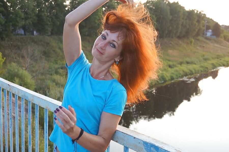 Flamehair in evening on the bridge
