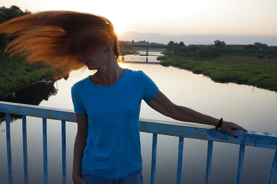 Flamehair in evening on the bridge