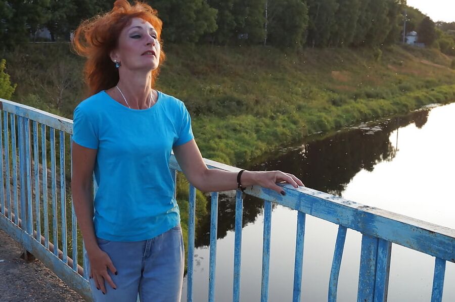 Flamehair in evening on the bridge