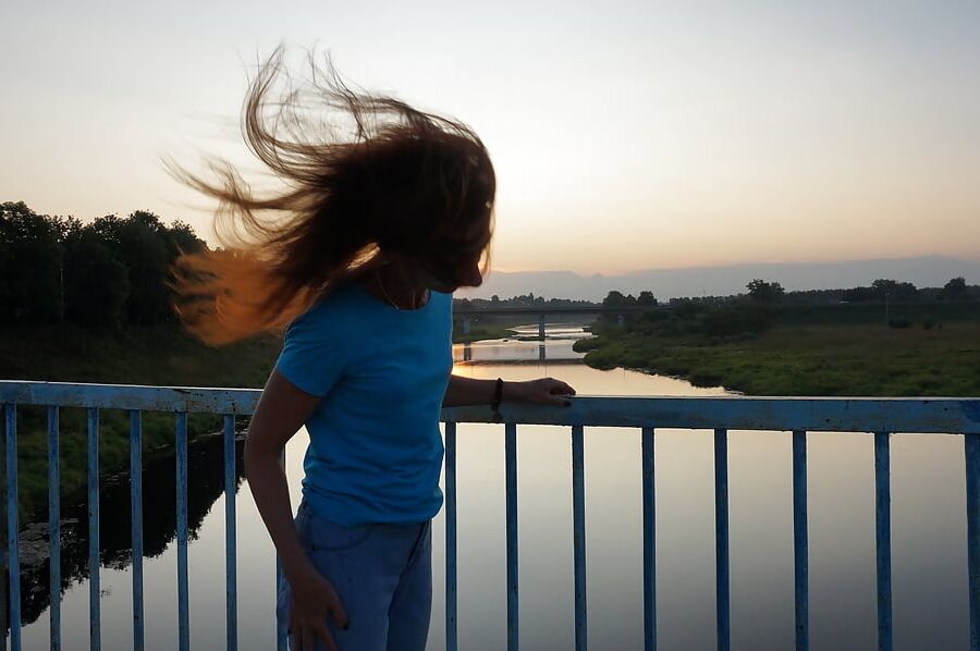 Flamehair in evening on the bridge