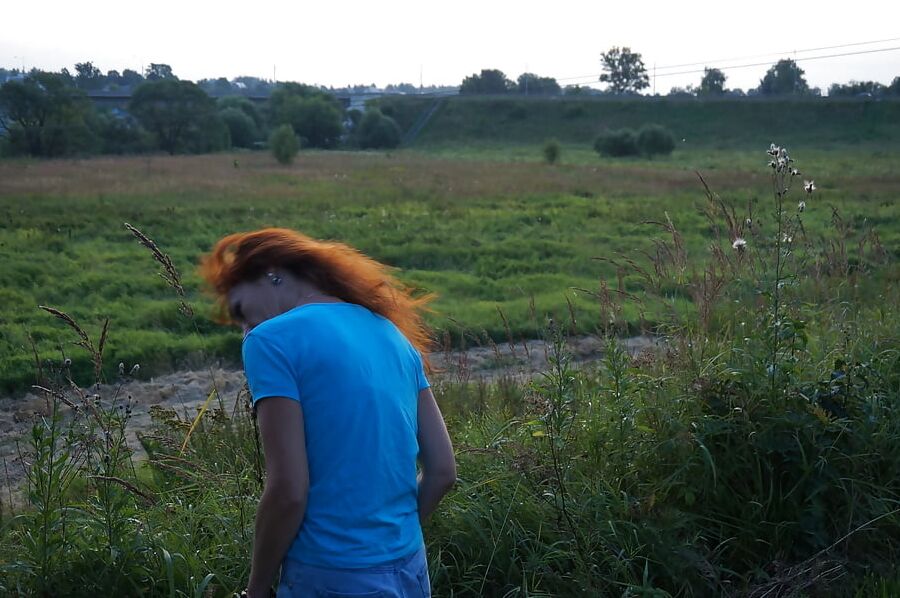 Flamehair in evening on the bridge