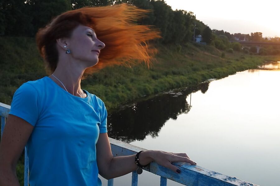 Flamehair in evening on the bridge