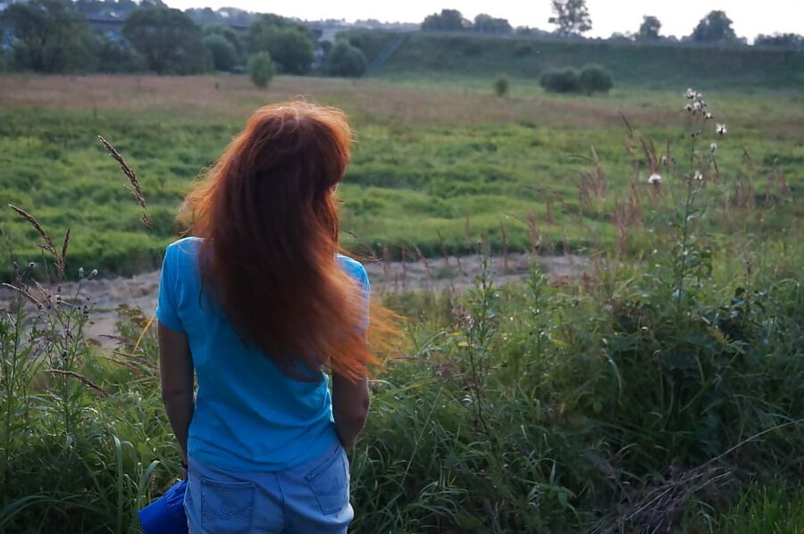 Flamehair in evening on the bridge