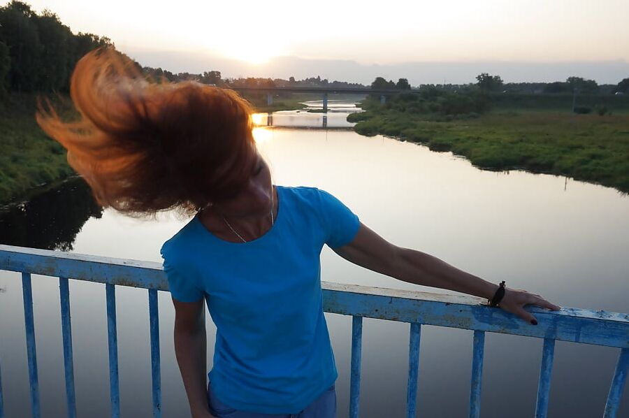 Flamehair in evening on the bridge