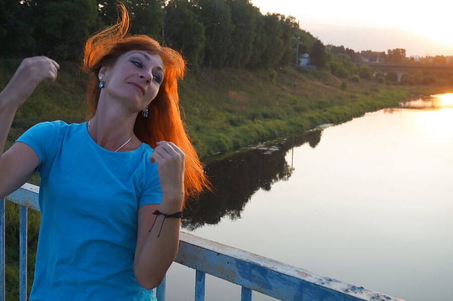 Flamehair in evening on the bridge
