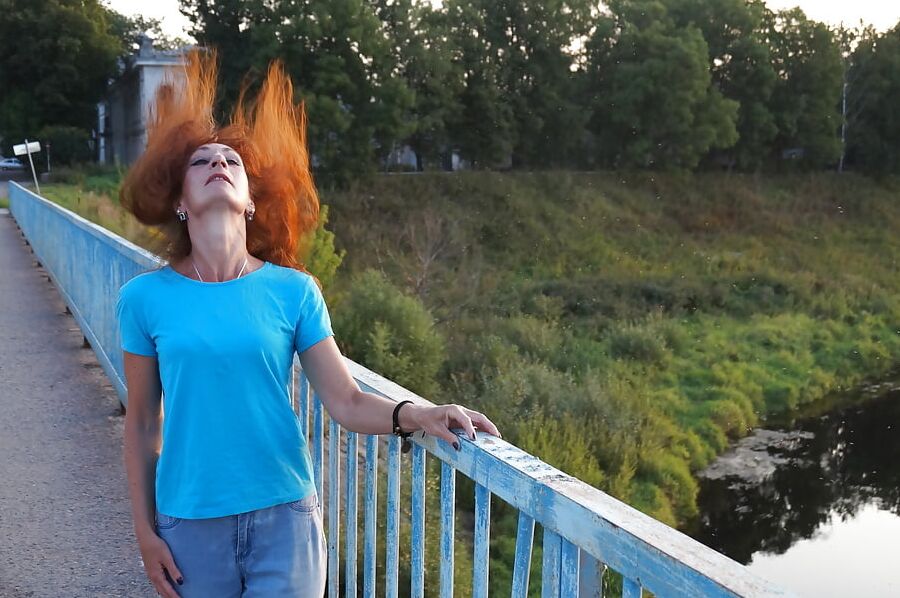 Flamehair in evening on the bridge
