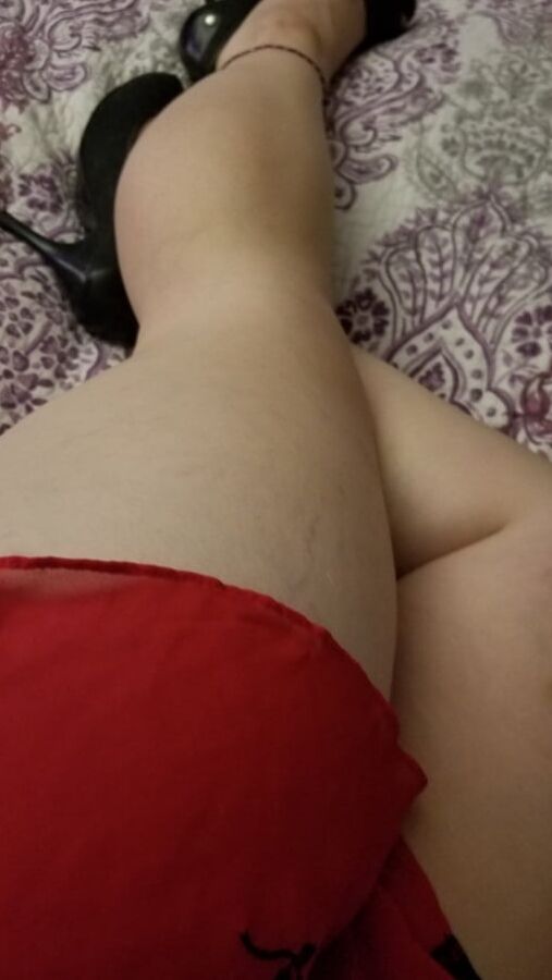 Naughty housewife tease black heels and red lingerie. Milf
