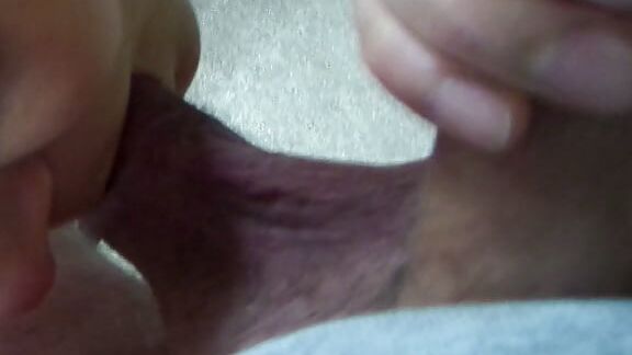 On her knees sucking my cock and balls