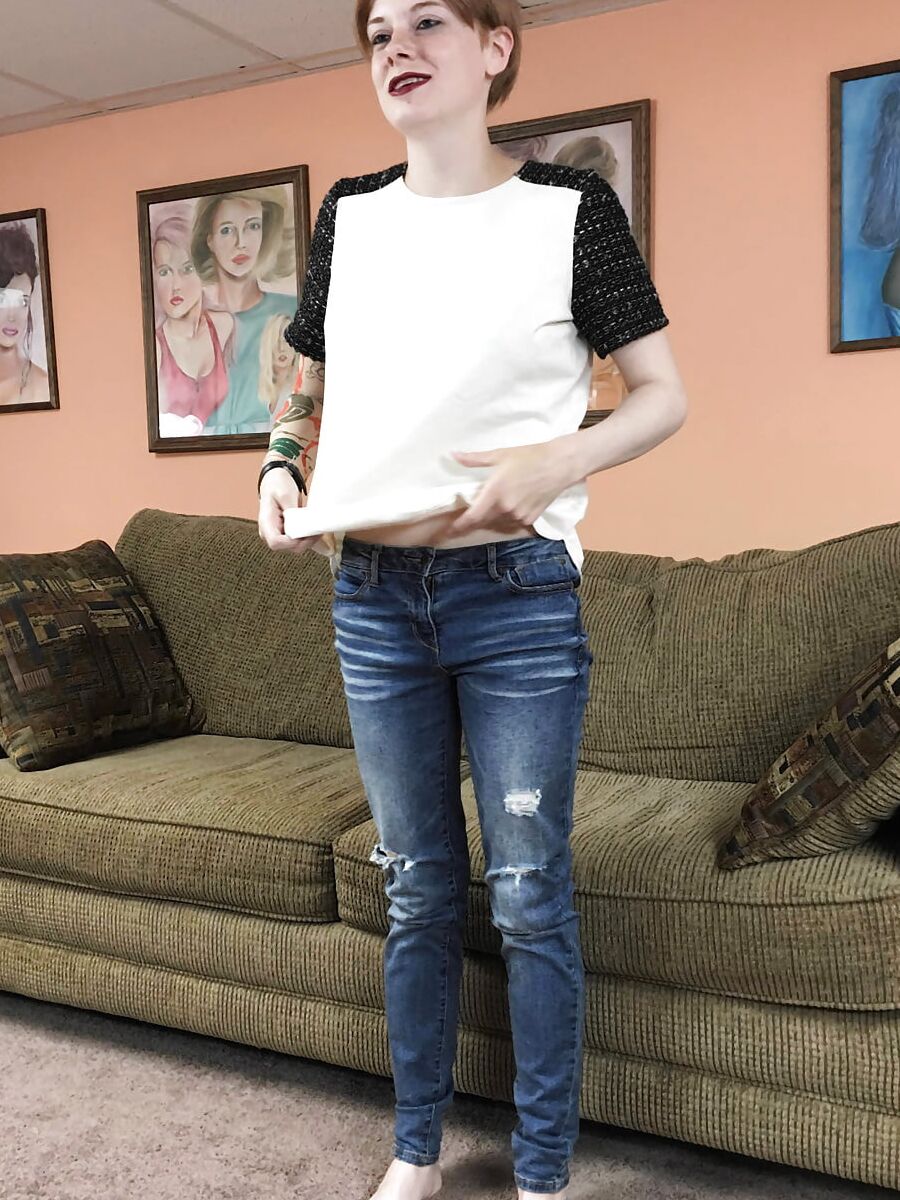 Redhead coed Ava Little shows off her tits